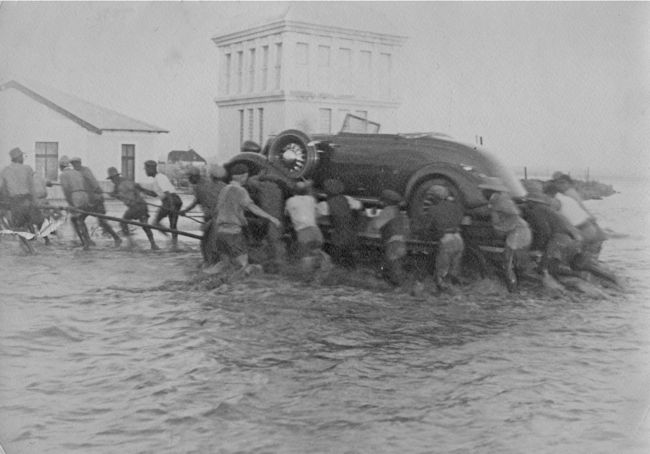 When the Swakop River was flooded in 1934 the railway line to Windhoek was washed away and new cars arriving from the United States had to be manhandl