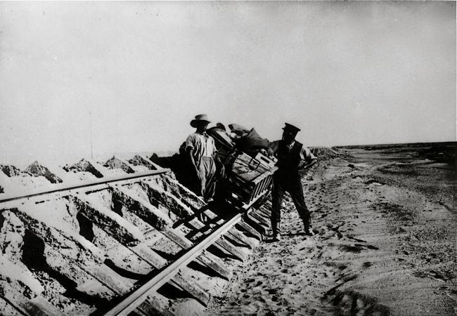 Damaged railway line, washed away by flash floods, after floods in 1934. In background railway bridge