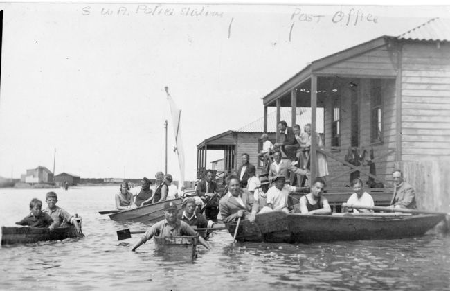 Floods in Walvis Bay, 1934. People in boats on what was streets