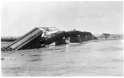Railway line and bridge over Swakop River damaged by floods, Swakopmund, 1934 