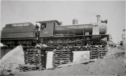 Steam locomotive on railway line washed away by floods after Khan River floods. 1934 