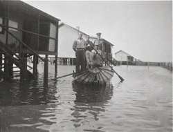 Floods in Walvis Bay. Men in boat. 1934 