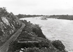 Omaruru river in flood, left railway line. Around 1911 